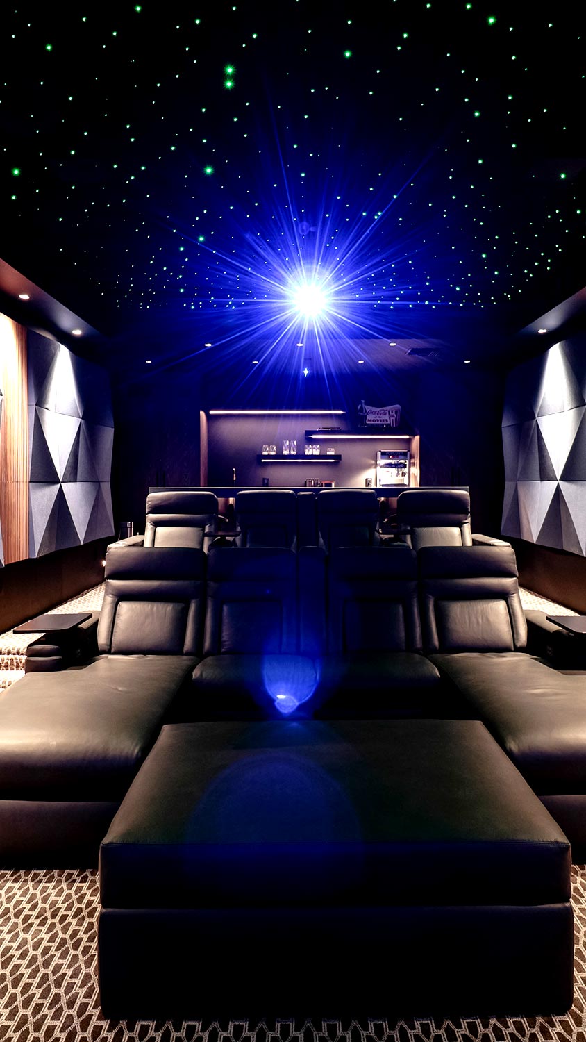 Luxury home theater with leather reclining seats and star-ceiling effect